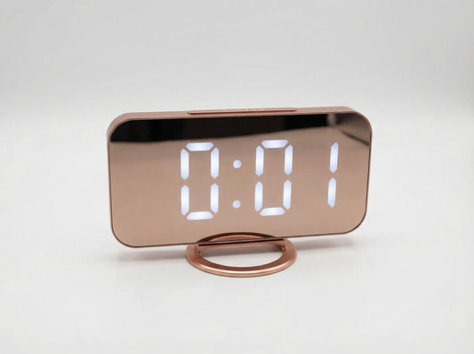 Modern, multifunctional alarm clock with a large mirror display, adjustable brightness, and USB charging.