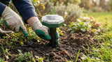 HIULLEN 4 pack solar mole repellers emitting ultrasonic waves to deter moles and gophers in a garden setting.