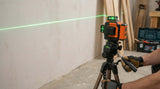 Takamine Tech3x360 3D Green Laser Level TT12LS with self-leveling feature and clear visibility in construction setting.