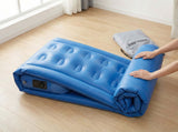 CAMULAND twin air mattress with built-in pump, featuring a durable surface and convenient inflating mechanism.